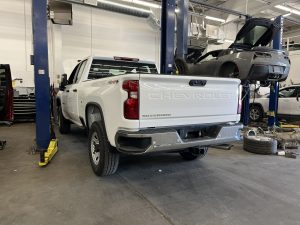 Image of a Chevy Silverado in the service department getting work done