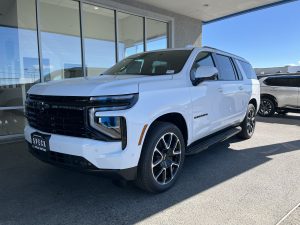 Image of a new 2026 Chevrolet Suburban in front of the dealership