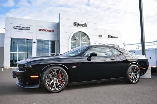 Black Dodge car parked at dealership lot