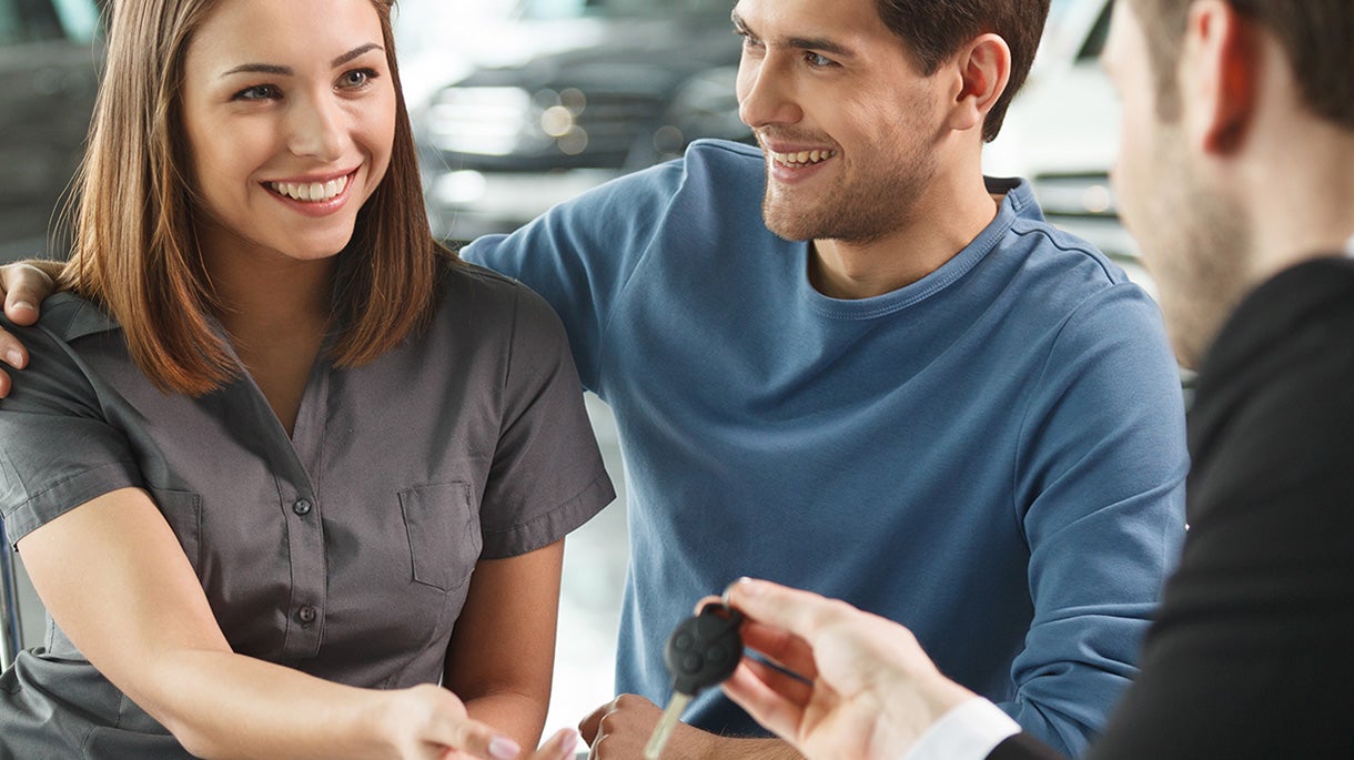 a couple getting vehicle financing img