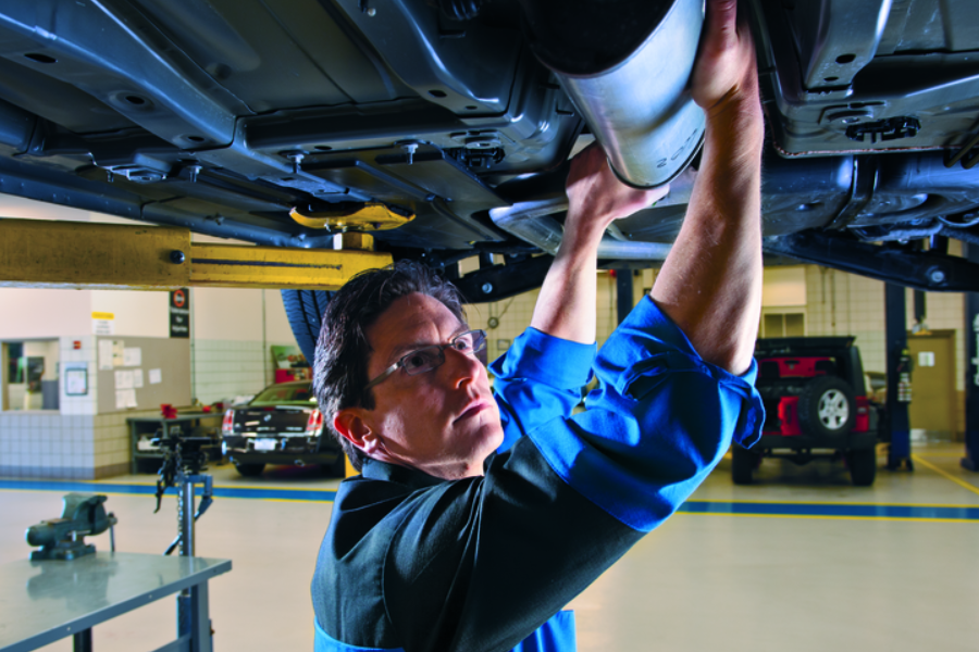 A technician repairing a car.