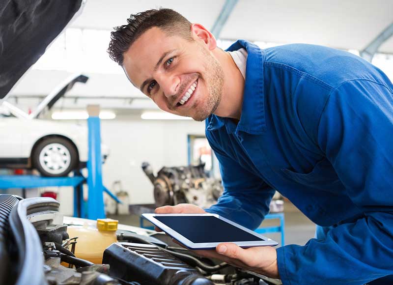 service technician looking at camera smiling img